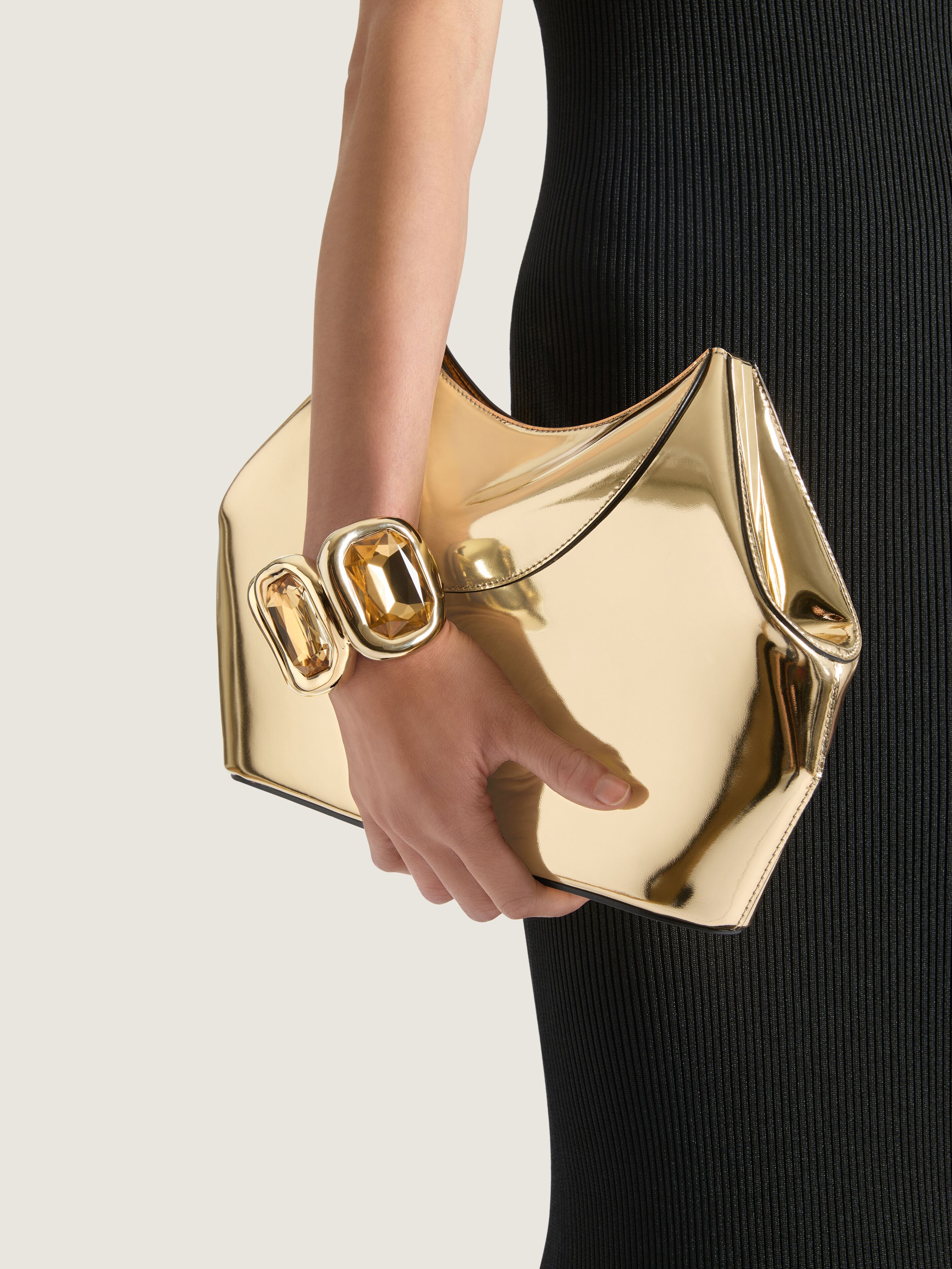 Facet clutch in mirror effect leather